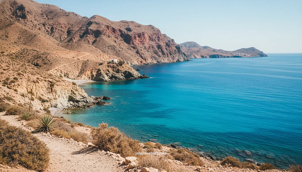 Dry desert mountains meeting bright blue Mediterranean water on the Costa de Almería Spain coastline