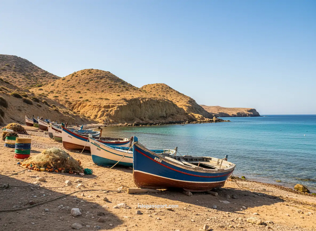 Fishing boats on the shore in Carboneras with Cabo de Gata hills behind them