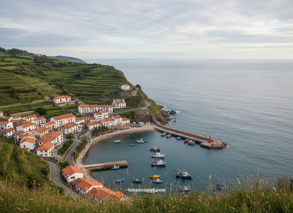 Cliffside view of Lastres with white houses above a small fishing harbor in Asturias