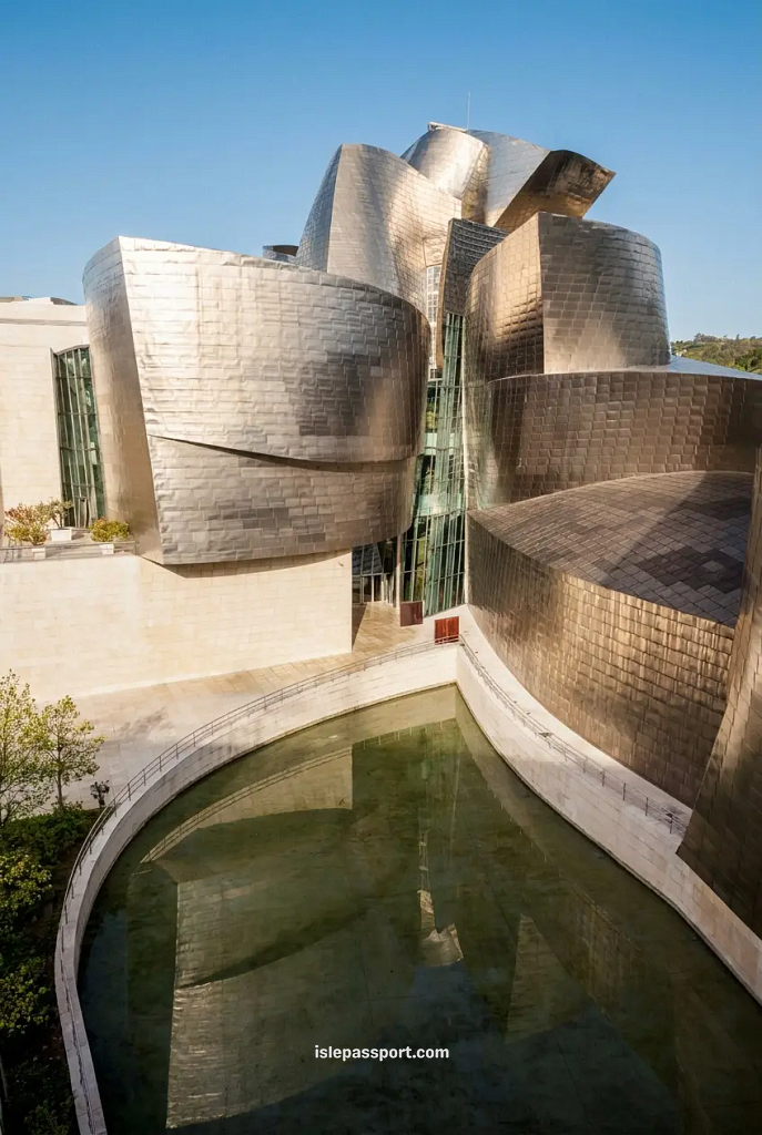 Close-up of the titanium curved exterior of the Guggenheim Museum Bilbao reflected in the surrounding water pool