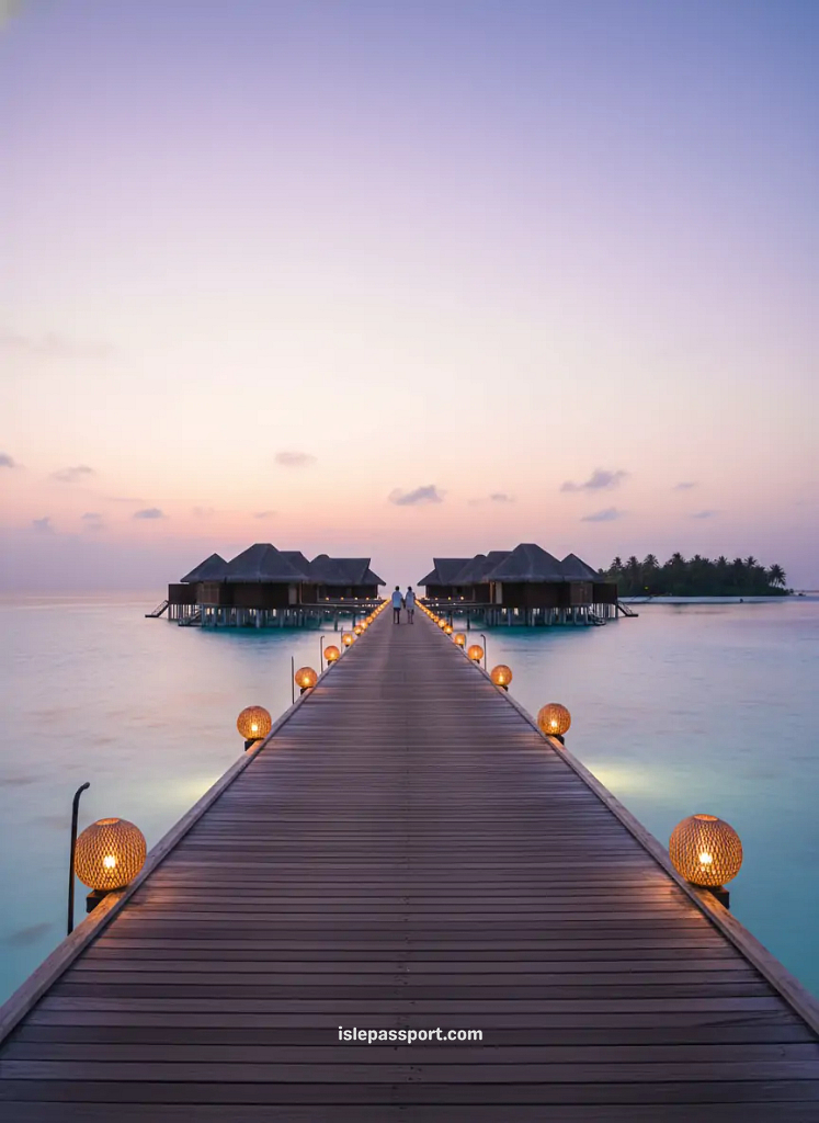 Maldives overwater bungalows with lantern-lit boardwalk at sunse