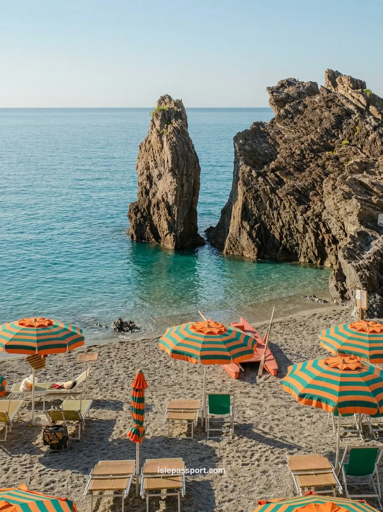 Clear turquoise water and the sandy shoreline of Feniglia beach near Porto Ercole on the Monte Argentario peninsula.