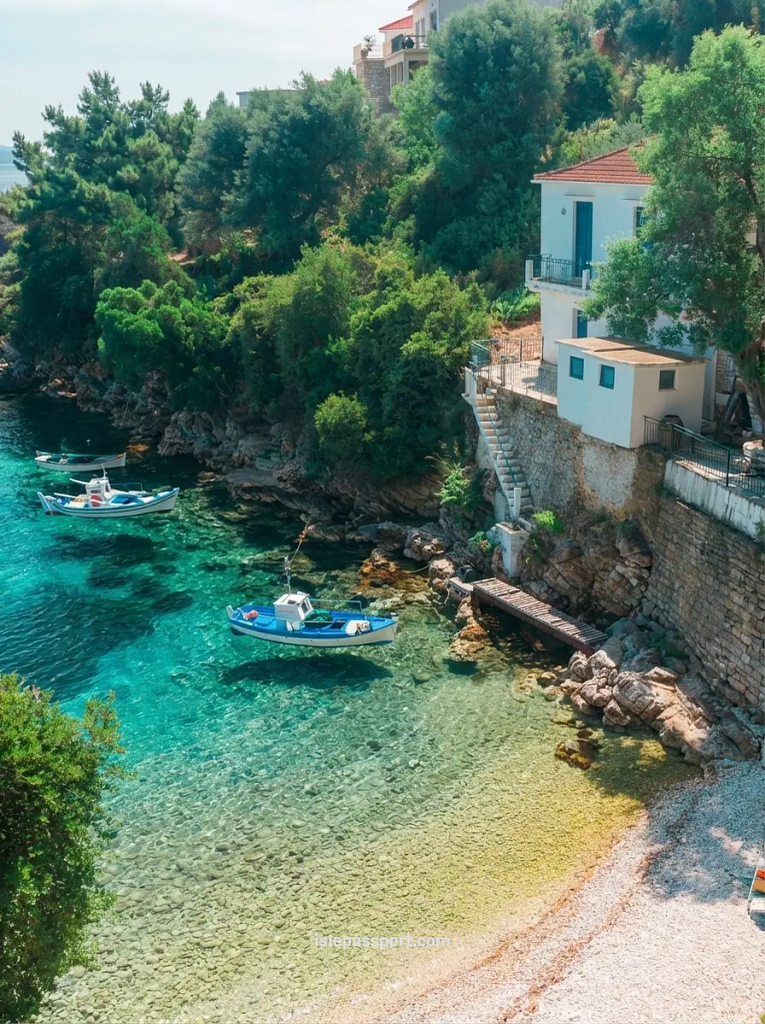 Secluded cove with boats and clear water in the Ionian Islands, part of the Cyclades vs Ionian vs Dodecanese comparison.