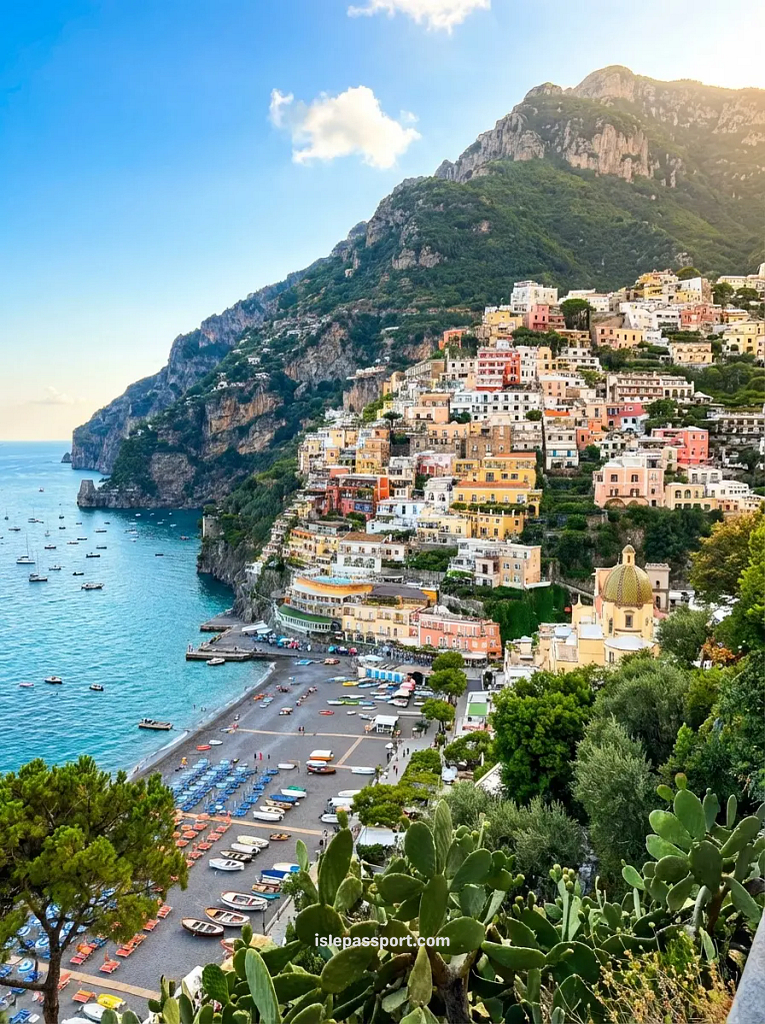 Panoramic view of Positano's pastel cliffside buildings, beach and bay, Amalfi Coast Italy