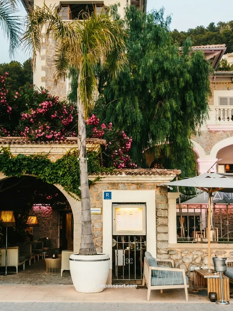 The stone villa exterior of Randemar restaurant in Port de Sóller with oleander flowers.