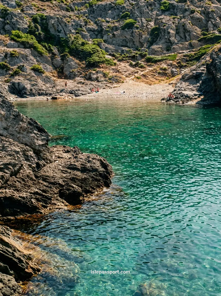 The rugged, rocky coastline and clear blue water of Cala Culip cove in the Cap de Creus Natural Park near Cadaques.