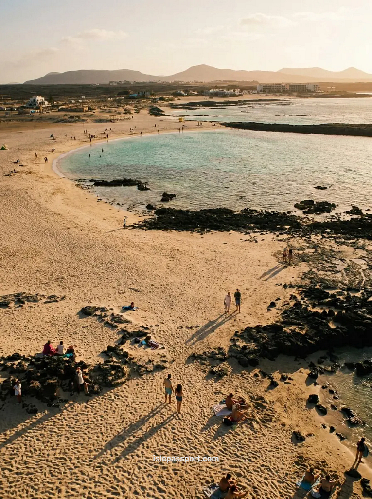 Aerial view of La Concha lagoon in El Cotillo, Fuerteventura in winter, sheltered turquoise water inside a natural reef