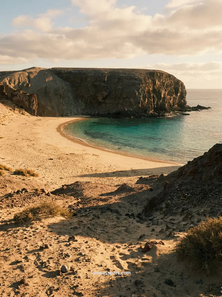 Empty cove near Playa Blanca in Lanzarote in winter, turquoise water and quiet golden sand