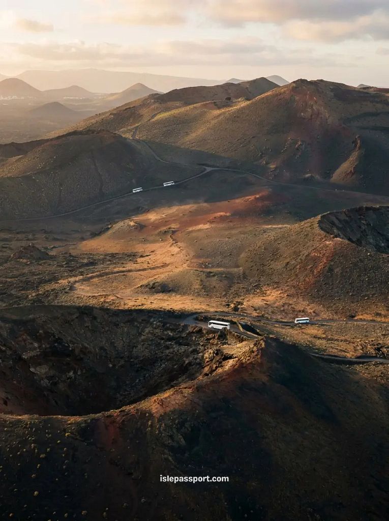 Route of the Volcanoes bus tour through Timanfaya National Park, Lanzarote in winter at sunrise